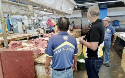 <p><strong>AFRICAN SWINE FEVER</strong>. National Meat Inspection Service officials conduct surveillance activities at a public market in Mandaue City on March 24, 2023. Mandaue City and 11 areas in Cebu province, including Cebu City, have tested positive for the African swine fever virus. <em>(Photo courtesy of NMIS-7)</em></p>