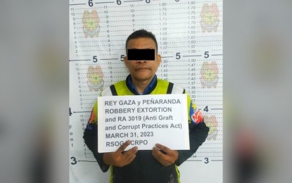 <p>ARRESTED.  Metropolitan Manila Development Authority (MMDA) traffic enforcer Rey Gaza was held for extortion Friday (March 31, 2023) during an entrapment operation in Manila. <em> (Photo courtesy of NCRPO) </em></p>