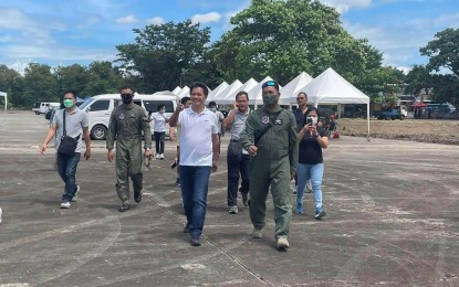 <p><strong>OLD AIRPORT SITE.</strong> Bacolod City Mayor Alfredo Abelardo Benitez (center) visits an event of the Philippine Air Force at the old airport during the Masskara Festival in October last year. On Monday (April 3, 2023), Benitez said the old airport is being eyed for redevelopment to become a new economic growth center and spread growth in the southern part of the city. <em>(Photo courtesy of Albee Benitez Facebook)</em></p>