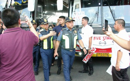 <p><strong>INSPECTION.</strong> PNP officer in charge, Lt. Gen. Rhodel Sermonia (center), leads the inspection of various government agencies at a bus terminal in Quezon City on Holy Wednesday (April 5, 2023). The inspection is aimed at ensuring the security and safety of travelers for the annual Holy Week observance. <em>(PNA photo by Robert Alfiler)</em></p>
