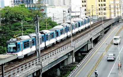 <p><strong>OPERATIONS RESUME</strong>. A Metro Rail Transit Line 3 train approaches Kamuning Station northbound along EDSA on April 4, 2023. Most train services in Metro Manila have resumed operations following a temporary suspension due to an earthquake Tuesday afternoon (Dec. 5, 2023). <em>(PNA photo by Ben Briones)</em></p>