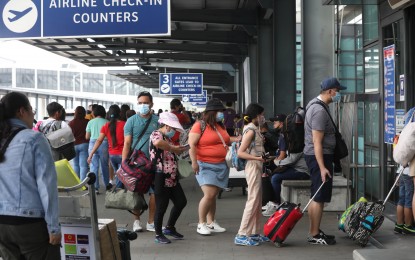 <p><strong>HOLIDAY RUSH.</strong> Passengers enter the Ninoy Aquino International Airport Terminal 3 on April 6, 2023. The Civil Aviation Authority of the Philippines is expecting 2.2 million passengers this month amid the holiday rush travel surge.<em> (PNA photo by Avito Dalan)</em></p>