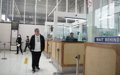 <p>BI Commissioner Norman Tansingco observes operations at immigration counters at the Ninoy Aquino International Airport (NAIA) on Wednesday (April 5, 2023). <em>(Photo courtesy of BI)</em></p>