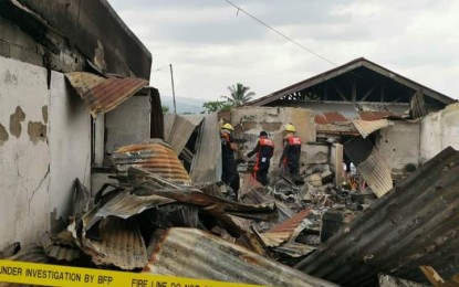 <p><strong>MARKET FIRE</strong>. Personnel of the Bureau of Fire Protection conduct an investigation of the fire that hit the public market of Barangay Cabacungan in La Castellana town, Negros Occidental province on Monday (April 10, 2023). At least 22 stalls have been destroyed by the blaze. <em>(Photo courtesy of Mayor Mhai-mhai Nicor-Mangilimutan) </em></p>