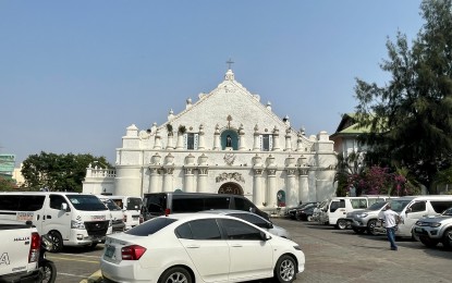 <p><strong>VISITA IGLESIA</strong>. Vehicles fill up a parking lot in front of the St. William Cathedral in Laoag City during the Holy Week as many churchgoers were on pilgrimage tours in the province. The Laoag church, along with St. Augustine Church in Paoay, Ilocos Norte, was among the most visited landmarks in the province. <em>(PNA photo by Leilanie Adriano)</em></p>