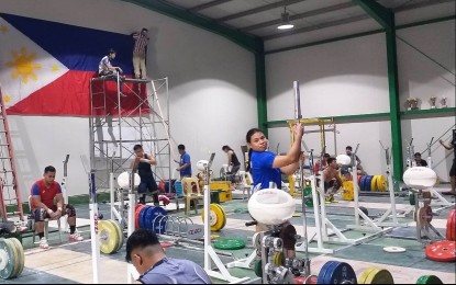 <p><strong>GETTING READY</strong>. Members of the weightlifting team train in the gym inside the Rizal Memorial Sports Complex in this undated photo. Nine athletes will compete in the Cambodia SEA Games next month.<em> (Contributed photo)</em></p>