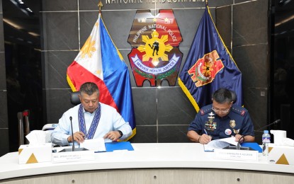 <p><strong>TRAINING FOR COPS.</strong> Philippine National Police (PNP) Chief, Gen. Rodolfo Azurin Jr. (right), and Department of Justice (DOJ) Secretary Jesus Crispin Remulla sign a memorandum of agreement in Camp Crame, Quezon City on Tuesday (April 11, 2023). Under the agreement, the DOJ will assist the PNP in equipping police investigators with skills and knowledge on case build-up to prevent charges from being dismissed in court due to technicalities. <em>(Photo courtesy of PNP)</em></p>