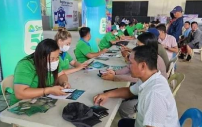 <p><strong>EXTENSION.</strong> Smart Communications personnel assist subscribers to have their SIM cards registered in this undated photo. The telecommunications companies on Wednesday (April 12, 2023) asked the government to extend the April 26 deadline for SIM registration. <em>(Photo courtesy of NTC Region 6)</em></p>