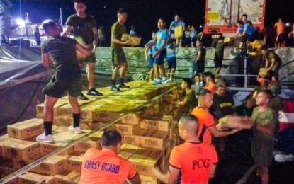 <p><strong>BEEFING UP.</strong> Personnel from the Army and Coast Guard unload family food packs to beef up supply in Eastern Visayas in this Feb. 11, 2023 photo. The Department of Social Welfare and Development (DSWD) has prepositioned 40,088 family food packs (FFPs) in strategic areas of Eastern Visayas primarily for the impacts of weather disturbances.<em> (Photo courtesy of DSWD)</em></p>