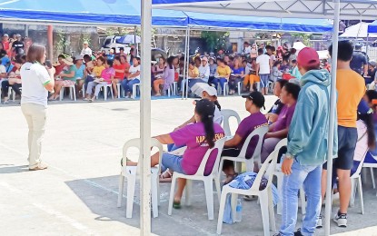 <p><strong>NO TO MINING.</strong> Residents listen during a protest rally on Wednesday (April 12, 2023) as a town official of Sta. Catalina, Negros Oriental explains the dangers of gold mining in Sitio Tarug in Barangay San Francisco. Mayor Peve Ligan on Thursday (April 13) met with Vice Gov. Manuel Sagarbarria to help efforts to stop an ongoing mining exploration in her town. <em>(Photo courtesy of Bhoy Pilonggo)</em></p>