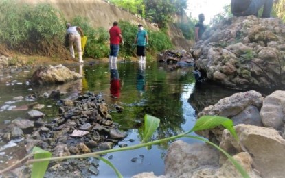 <p><strong>EASEMENT.</strong> Local government employees are seen cleaning one of the seven major river systems in Cebu City in this undated photo. Cebu City Disaster Risk Reduction and Management Council chairman Gerardo Carillo on Thursday (April 13, 2023) said the city government will give housing for the riparian settlers whose houses fall within the three-meter easements. (<em>Photo courtesy of Cebu City PIO)</em></p>
