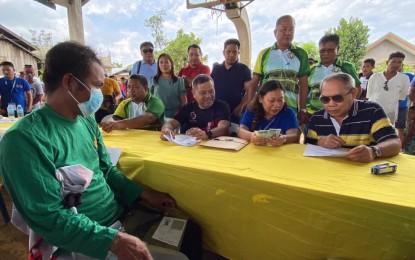 <p><span class="s1"><strong>AID TO DISPLACED WORKERS</strong>. Surigao del Norte 1st District Rep. Francisco Jose Matugas II (sitting, 2nd left), together with former Gov. Francisco Matugas (sitting, right), leads the distribution of payments to 551 TUPAD beneficiaries on April 12, 2023 in San Isidro, Siargao Island, Surigao del Norte. Some PHP2.8 million worth of payments were received by the TUPAD beneficiaries after rendering a 15-day community service. (<em>Photo courtesy of Rep. Bingo Matugas)</em></span></p>