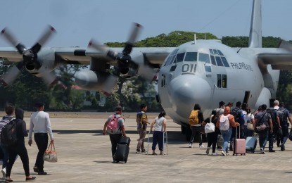<p><strong>EN ROUTE.</strong> Witnesses to the Pamplona massacre, where Negros Oriental Governor Roel Degamo and eight others were killed, board a Philippine Air Force C-130 aircraft bound for Manila at the Dumaguete-Sibulan airport in Dumaguete City on Saturday (April 15, 2023). Led by Pamplona Mayor Janice Degamo, they will be attending the Senate committee hearing and the Department of Justice investigation starting April 17 on the mass shooting and other killings in Negros Oriental. <em>(PNA photo by Judy Flores Partlow)</em></p>