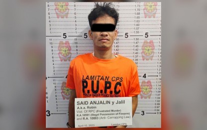 <p><strong>ARRESTED</strong>. Law enforcers arrest Said Anjalin, an alleged contract killer, in a manhunt operation in Barangay Malinis, Lamitan City, Basilan, early Saturday (April 15, 2023). The manhunt against Anjalin was launched after a failed gun attack on Patrolman Faisal Isah Alih in Sitio Patikul, Barangay Matatag, Lamitan City on April 14.<em> (Photo courtesy of Lamitan City Police Station)</em></p>