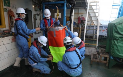 <p><strong>SEALED.</strong> The crew of Japanese dynamic positioning vessel, Shin Nichi Maru, prepares the bag that will cap oil leaks at the sunken M/T Princess Empress in Oriental Mindoro in this undated photo. The Philippine Coast Guard reported on Monday (April 17, 2023) the completion of underwater operations. <em>(Courtesy of PCG)</em></p>