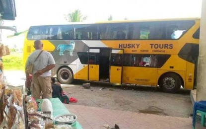 <p><strong>BUS EXPLOSION.</strong> A brand-new double-decker bus unit operated by Husky Tours Bus Company is bombed while parked at the Isulan public terminal in Isulan town, Sultan Kudarat province, leaving six passengers injured. Police have yet to determine the brains behind the explosion.<em> (Photo courtesy of Sultan Kudarat PPO)</em></p>