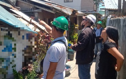 <p><strong>INSPECTION</strong>. Engineers of More Electric and Power Corp. (MORE Power) inspect the electrical connection of houses in Barangay Mansaya, Lapuz District in Iloilo City on Tuesday (April 18, 2023). The inspection was part of the Integrated Approach to Fire Prevention program initiated by the local government, MORE Power, the Bureau of Fire Protection, and concerned stakeholders to address fire incidents caused by electrical problems. <em>(Photo courtesy of MORE Power)</em></p>