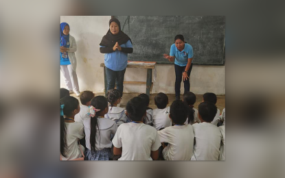 <p><strong>DEBRIEFING.</strong> Nurses of the Ministry of Basic, Higher, and Technical Education's Lamitan City Division conduct psychosocial debriefing to school children as classes resumed at the Simbangon Elementary School, Lamitan City, Basilan province on Tuesday (April 18, 2023). The school was closed on March 28 after the relatives of Simbangon village chief Robert Jalal figured in armed clashes. <em>(Photo courtesy of Ronda del Basilan)</em></p>