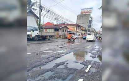 <p><strong>POTHOLES</strong>. A portion of the damaged highway in Samar province. The 109-km. damaged road in Samar province along the nautical highway that links Luzon to Mindanao will only get a budget of PHP18.35 million for its repair this year, the Department of Public Works and Highways said on Tuesday (April 18, 2023). <em>(Photo courtesy of Calbayog Update)</em></p>