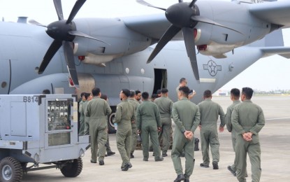 <p>PAF Airlifters joined by USAF counterparts in a walk through during the demonstration of one of the processes in Prop Blending of a C130J. <em>(Photo courtesy of PAF) </em></p>