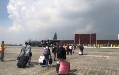 <p><strong>HOMEWARD BOUND.</strong> Witnesses in the death of Negros Oriental Governor Roel Degamo and other unsolved killings in the province board a C-130 Air Force plane on Friday (April 21, 2023) bound for home. The late governor's widow, Pamplona Mayor Janice Degamo, and the other witnesses departed the province on April 15 for Metro Manila for the Senate hearings<em>. (Contributed photo)</em></p>