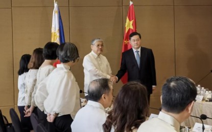 <p><strong>TRUE RELATIONS.</strong> Foreign Affairs Secretary Enrique Manalo (left, in barong tagalog) shakes hand with Chinese Foreign Minister Qin Gang at Diamond Hotel Manila in Malate District on Saturday (April 22, 2023). The two officials have agreed to "properly" discuss the two countries’ differences to manage maritime rows. <em>(Photo courtesy of Chinese Embassy in Manila)</em></p>