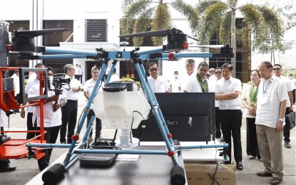 <p><strong>AGRI BOOST</strong>. President Ferdinand R. Marcos Jr. Checks on locally manufactured machinery displayed inside the Central Luzon State University in the Science City of Munoz, Nueva Ecija province on Monday (April 24, 2023). The Philippine Center for Postharvest Development and Mechanization (PhilMech) manufactures agricultural equipment that aid the country's planting, cultivation, harvesting and post-production projects. <em>(PNA photo by Alfred Frias)</em></p>