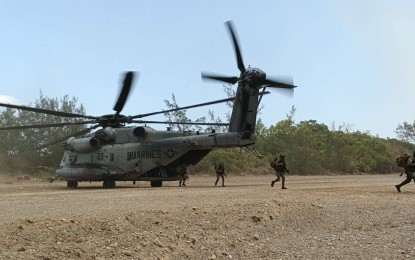 <p>Participating soldiers alight the US Marines Super Stallion helicopter during the air assault operations which is part of the ongoing "<em>Balikatan</em>" Exercise held at the Paredes Air Station, Barangay 32 Sapat, Pasuquin, Ilocos Norte on April 23, 2023. <em>(Photo courtesy of PA) </em></p>