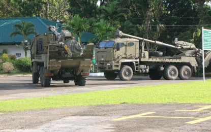 <p>Two units of the Autonomous Truck Mounted Howitzer System (ATMOS) 155mm self-propelled guns on stand-by at the 3rd Infantry Division headquarters in Jamindan town, Capiz province. <em>(Photo courtesy of PA) </em></p>