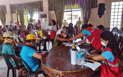 <p><strong>CASH ASSISTANCE.</strong> The Department of Social Welfare and Development on Tuesday (April 25, 2023) distributed cash aid under the Assistance to Individuals in Conflict Situations (AICS) in Siaton town,  Negros Oriental province.  The beneficiaries are members of a farmers' group that are locked in a land dispute in Barangay Napacao, Siaton. <em>(Photo by Judy Flores Partlow)</em></p>