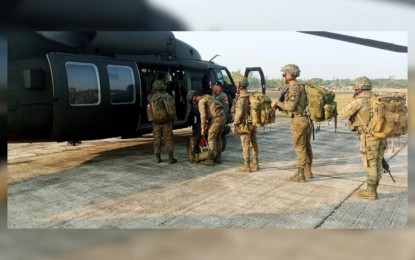 <p><strong>ASSAULT EXERCISE.</strong> Participating troops in the long-range multi-ship joint air assault exercise board the PAF S-70i "Black Hawk" combat utility helicopter at Fort Magsaysay on April 23, 2023. <em>(Photo courtesy of PAF) </em></p>