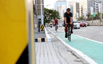<p><strong>BIKER-FRIENDLY.</strong> Cyclists make use of the bike lane along the busy Epifanio de los Santos Avenue in Quezon City on April 25, 2023. The city is becoming cyclist-friendly with more than 90 km. of bike lanes and facilities. <em>(PNA photo by Robert Oswald P. Alfiler)</em></p>