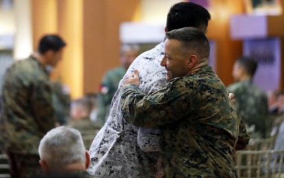 <p><strong>BROTHERHOOD.</strong> Filipino and American soldiers bid each other goodbye as the “Balikatan 38-2023” military exercises end with a farewell ceremony at the Armed Forces of the Philippines headquarters in Camp Aguinaldo, Quezon City on Friday (April 28, 2023). Military chief Gen. Andres Centino said the activity, attended by 17,767, was a success and the biggest in four decades.<em> (PNA photo by Robert Oswald P. Alfiler)</em></p>