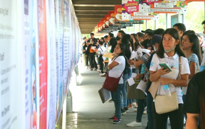 <p><strong>LOWER UNEMPLOYMENT RATE.</strong> Jobseekers look at a list of vacancies during the Labor Day Job Fair in Davao City on May 1, 2023. The country's unemployment rate went down to 4.5 percent in September this year from 5 percent in the same month last year, the Philippine Statistics Authority reported on Wednesday (Nov. 8, 2023).<em> (PNA photo by Robinson Niñal Jr.)</em></p>
<p><em> </em></p>