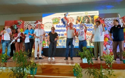 <p><strong>LABOR DAY IN CARAGA.</strong> The Department of Labor and Employment in the Caraga Region, led by Director Joffrey Suyao (4th from right), opens the 121st Labor Day celebration on May 1, 2023 in Butuan City. Aside from the job fair, the celebration in the region also features a Kadiwa ng Pangulo and the release of PHP16.7 million worth of livelihood aid to 1,041 beneficiaries. <em>(Photo courtesy of Butuan City PIO)</em></p>