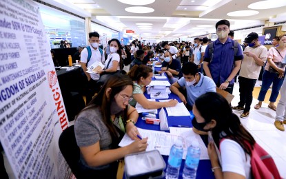 <p><strong>SCREENING</strong>. Employers interview applicants, some of whom were hired on the spot, during a job fair at a Marikina City mall on Labor Day (May 1, 2023). The Maharlika Investment Fund can generate a 0.07-percentage point economic growth annually in the first 10 years of operation and generate about 100,000 direct and indirect jobs, the Department of Finance said Friday (Sept. 8, 2023). <em>(PNA photo by Joey O. Razon)</em></p>
<p> </p>