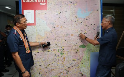 <p><strong>3-MINUTE RESPONSE TIME.</strong> QCPD director Brig. Gen. Nicolas Torre III (right) gives PNP chief Gen. Benjamin Acorda Jr. (left) a brief tour of the police district's Integrated Command Control Center (ICCC) at Camp Karingal, Quezon City on Monday (May 1, 2023). The ICCC is a state-of-the-art facility that aims to achieve the Three-Minute Response Time (3MRT) of police personnel where they are located at fixed points or nearby areas for any reported crime incidents which can be replicated nationwide. <em>(Photo courtesy of PNP Public Information Office)</em></p>