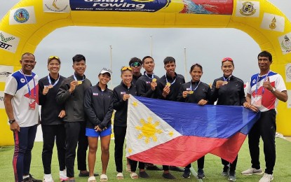 <p><strong>WORLD BEACH BOUND</strong>. A group photo of the Philippine rowing team composed of (L-R) Nicanor Jasmin (coach), Kristine Paraon, Cris Nievarez, Kharl Julienne Sha, Feiza Jane Lenton, Christian Joseph Jasmin, Zuriel Sumintac, Edgar Ilas, Joanie Delgaco, Amelyn Pagulayan and Edgardo Maerina (coach) after the awarding ceremony of the Asian Rowing Beach Sprint Championships in Pattaya, Thailand on April 30, 2023. The mixed double sculls pair of Ilas and Delgaco won the gold medal and qualified for the World Beach Games this August in Bali, Indonesia. <em>(Contributed photo)</em></p>