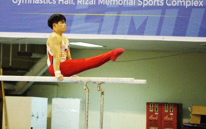 <p><strong>PRACTICE</strong>. Carlos Yulo during practice at Rizal Memorial Sports Complex in Manila on May 2, 2023. Early on Sunday (June 28, 2024, PH time), Yulo finished eighth in the all-around category of the Paris Olympics men's artistic gymnastics event, well within the top 24 cutoff for the medal round. <em>(PNA file photo by Jess M. Escaros Jr.)</em></p>