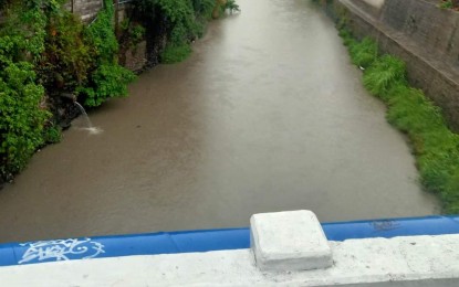<p><strong>FLOOD MONITORING</strong>. The rise in the water level in one of the rivers in Bacolod City being monitored on Wednesday (May 3, 2023). The city and several local government units in Negros Occidental canceled classes in all levels on Thursday (May 4) due to heavy rainfall warning.<em> (Photo courtesy of Bacolod City PIO)</em></p>