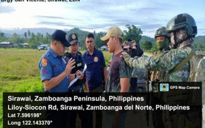 <p><strong>MANHUNT OPS</strong>. Police operatives arrest a Dawlah Islamiya extremist identified as Nordy Alip (center, with baseball cap) during a manhunt operation in Sirawai, Siocon, Zamboanga del Norte on Wednesday (May 3, 2023). The Area Police Command – Western Mindanao said Alip is the third most wanted person in Zamboanga Peninsula. <em>(Photo courtesy of APC-WM)</em></p>