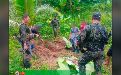 <p>EXHUMED. Government troops and villagers unearth a body of a village official killed by rebels last year. Troops recovered on Wednesday (May 3, 2023) the cadaver of Jaime Asinas, a village council member of San Jose, Las Navas, Northern Samar who went missing on July 19, 2022. <em>(Photo courtesy of Philippine Army)</em></p>