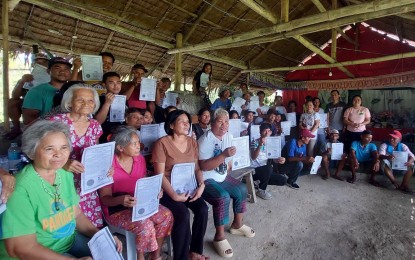 <p><strong>LAND TITLES</strong>. Some 49 farmers receive the owner’s duplicate copy for the 21.23-hectare property, formerly managed by Danao Development Corp., in Barangay Salamanca, Toboso town on April 25, 2023. The DAR Negros Occidental-I North facilitated the awarding of the land titles under the Comprehensive Agrarian Reform Program Extension with Reforms. <em>(Photo courtesy of DAR NegOcc-I North)</em></p>
