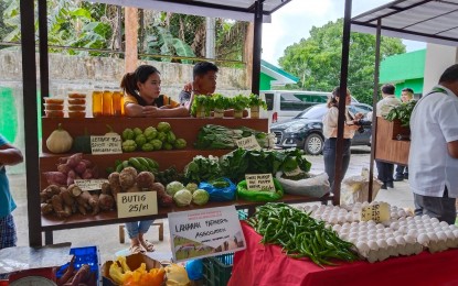 <p><strong>MARKETING ASSISTED.</strong> Farmers sell their produce in a Kadiwa store set up at the Department of Agriculture (DA) office in Tacloban City in this May 5, 2023 photo. The regional agriculture office, in partnership with local government units, is rolling out 26 Kadiwa stores this month to make affordable agricultural products more accessible to Eastern Visayas residents. <em>(PNA photo by Sarwell Meniano)</em></p>