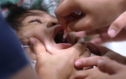 <p><strong>NO TO MEASLES, RUBELLA, POLIO</strong>. A child gets her oral polio vaccine from city health personnel in Pasig City on May 6, 2023. The Department of Health's Chikiting Ligtas 2023 campaign is being carried out nationwide, including in Occidental Mindoro province. <em>(PNA photo by Joey O. Razon)</em></p>