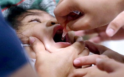 <p><strong>PROTECTED.</strong> A child receives her oral polio vaccine during the "Chikiting Ligtas sa Dagdag Kontra Polio, Rubella at Tigdas" immunization drive at SM City East Ortigas, Pasig City on Saturday (May 6, 2023). The Department of Health aims to inoculate at least 95 percent of children 0 to 5 years old against vaccine-preventable diseases across the country. <em>(PNA photo by Joey O. Razon)</em></p>
