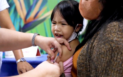 <p><strong>VACCINATION DRIVE.</strong> A toddler grimaces in pain while receiving her measles-rubella vaccine at the "Chikiting Ligtas sa Dagdag Kontra Polio, Rubella at Tigdas" immunization drive in Pasig City on May 6, 2023. The Department of Health said Friday (Dec. 22) that the country has logged 2,594 measles and rubella cases for the first 11 months of this year. <em>(PNA photo by Joey O. Razon)</em></p>