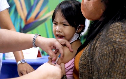 <p><strong>THAT HURTS.</strong> A toddler grimaces in pain while receiving her measles-rubella vaccine at the "Chikiting Ligtas sa Dagdag Kontra Polio, Rubella at Tigdas" immunization drive at SM City East Ortigas, Pasig City on Saturday (May 6, 2023). The Department of Health-led activity for the entire May will inoculate children aged 9 to 59 months old with one dose of Measles-Rubella vaccine and children aged 0 to 59 months old against poliovirus types 1 and 3 with one dose of Bivalent Oral Polio Vaccine.<em> (PNA photo by Joey O. Razon)</em></p>