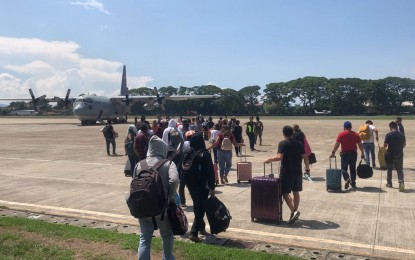 <p><strong>SEEKING JUSTICE.</strong> Witnesses to the killings in Negros Oriental board a C-130 Air Force aircraft at the Dumaguete-Sibulan airport on May 9, 2023. They attended the resumption of the Senate inquiry into the murder of Gov. Roel Degamo and other killings in Negros Oriental.<em> (PNA file photo)</em></p>
