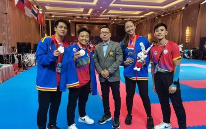 <p><strong>SEA GAMES 2023</strong>. Alejandro Vasquez (middle), chief instructor at the Filipinas Wado Ryu Karatedo Renmei based in Dagupan City, poses with his students who are members of the Philippine Karate Team which competed and won medals in the 2023 SEA Games in Cambodia. They are (from left) John Matthew Manantan, his son John Enrico Vasquez, Arianne Isabel Brito and Jayson Macaalay. <em>(Photo courtesy of Dr. Vasquez's Facebook account)</em></p>